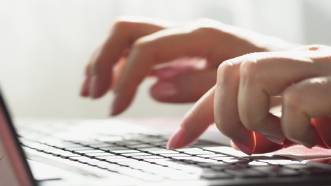 Woman freelancer working on laptop at home-office. Close up of female hands. Businesswoman writing business letter at work. Typing on keyboard