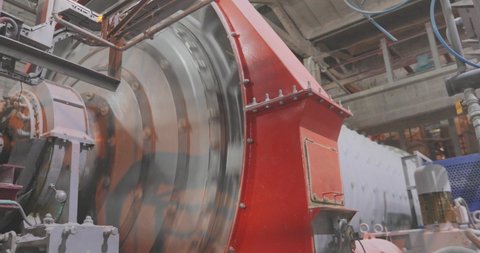 Cylinder Ball Mill in a Large Factory. Ball mill, mill at the factory, grinding with metal balls
