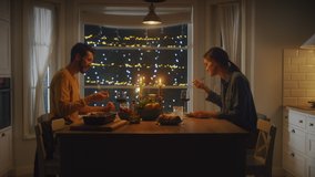 Happy Young Couple in Love Have Romantic Dinner, Toasting Each other with Glasses of Wine, Eating Tasty Meal in the Kitchen, Celebrating and Talking. Lovely Husband and Wife Have Romantic Time - Powered by Shutterstock - Get 15% off with code: PIKWIZARD15