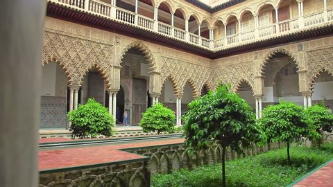 Seville, Andalusia, Spain - April 19, 2016: Patio de las Doncellas in Royal Alcazars of Seville or Reales Alcazares de Sevilla, Andalusian Architecture and old Arab Palace originally fort of Moors.