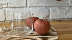 Delicious fresh squeezed apple juice in  transparent glass