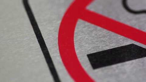 Close up of no smoking sign in public in pan shot