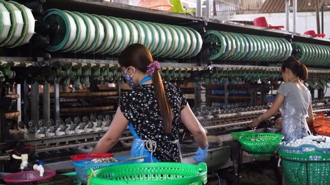 Dalat, Vietnam - march 18, 2020 : Silk farm, clothes produce from silkworm insects cocoon, textile factory. Factory for production of silk threads near Da Lat, Vietnam