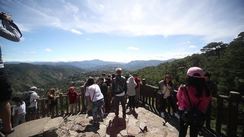 BAGUIO, PHILIPPINES - FEB 10: Tourists enjoy the overlook at Mines View Park Baguio on Feb 10, 2020. The landmark overlooks the abandoned gold and copper mines of Itogon.
