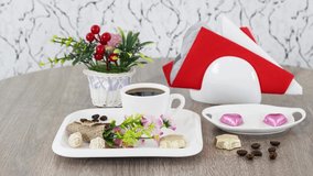 Coffee cup with sweets on table background.