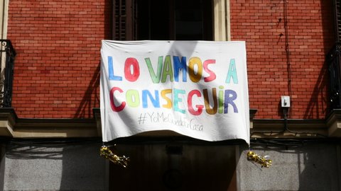 banner on the balcony of a house in the center of Madrid with the slogan: WE ARE GOING TO GET IT, due to the state of alarm in Spain for COVID-19. Filmed on April 18, 2020.