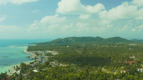 Video from a drone on samui island where you can see the beach road car people home rock mountain and palm trees with beautiful sea and ocean views in Siam Gulf of Thailand in excellent quality 4К