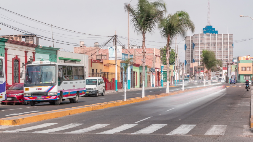 Monumental Callao is one of the new fashion areas near Lima timelapse. Gamara street traffic with colorful houses and restaurants. Lima Peru.