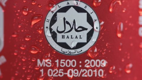 "Klang,Malaysia- Circa April, 2020: A footage of water vapour drop on halal logo at Coca Cola can drink."