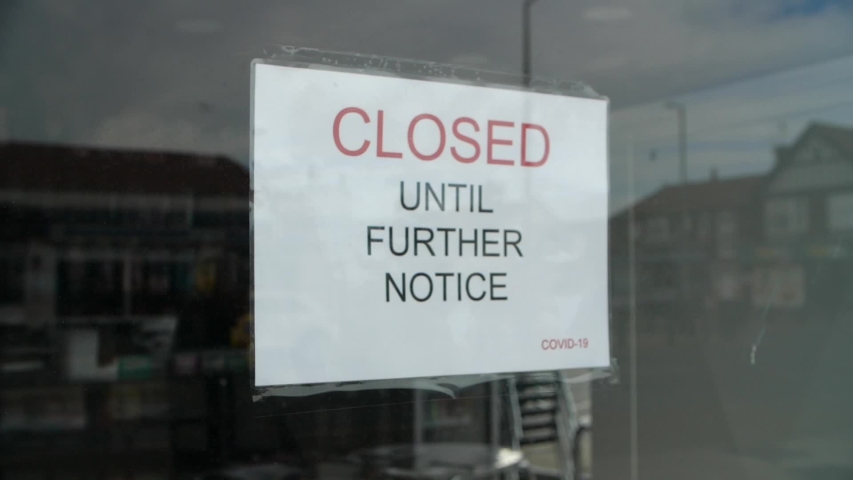 Slow motion shot of independent shop closed until further notice due to the COVID 19 coronavirus pandemic, bars, cafes, restaurants, clubs all shut cause of this international crisis | Shutterstock HD Video #1050818242