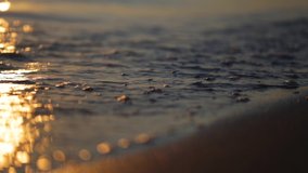 Closeup view video footage of  amazing golden dramatic early morning sunrise at peaceful sea beach of Greece.