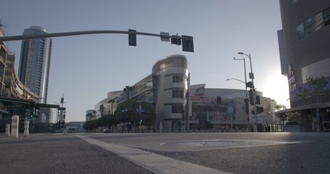 LOS ANGELES, CA, MAR 2020: Staples Center sports complex and nearby buildings at Figueroa and Olympic in South Park, Downtown, during coronavirus pandemic. Locked-off shot