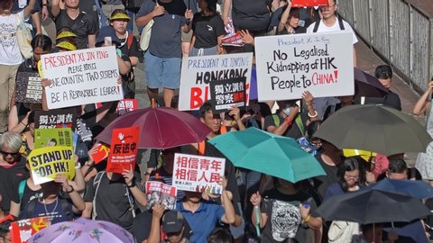 On July 1, 2019 in Hong Kong. Anti-ELAB Movement. Mass demonstrations. Closeup of legions of protesters took to the streets of Hong Kong to oppose the controversial extradition bill.
