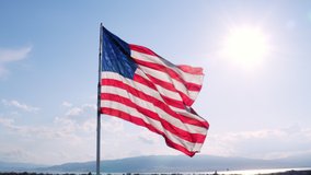 Aerial of massive American Flag slowly flapping in breeze in slow motion - Powered by Shutterstock - Get 15% off with code: PIKWIZARD15
