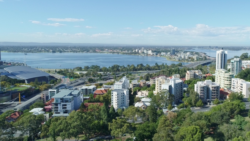 The skyline of Perth Western Australia CBD Australia and the freeways and Swan River from West Perth open space. Modern skyscrapers aerial view on clear day in April 8th 2020