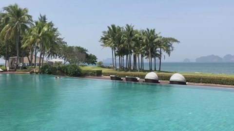Krabi, Thailand - February 8 2018: The seafront swimming pool of luxury hotel Phulay Bay, a Ritz Carlton Reserve resort