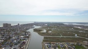 4K. Aerial view of Atlantic city. Atlantic coast. Drone footage of streets, hotels, shopping centers and residential buildings from above.