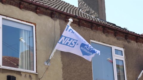 Kippax Leeds UK, 21st April 2020: Flag attached to businesses in the village of Kippax in Leeds West Yorkshire showing support for the NHS during coronavirus covid-19 pandemic saying Thank You NHS