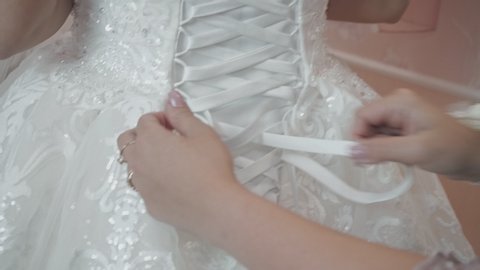 Bride is wearing a beautiful wedding dress close-up