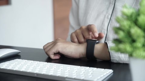 Bali Indonesia April 21, 2020 : woman typing on keyboard and using smart watch, concept Workspace Background
