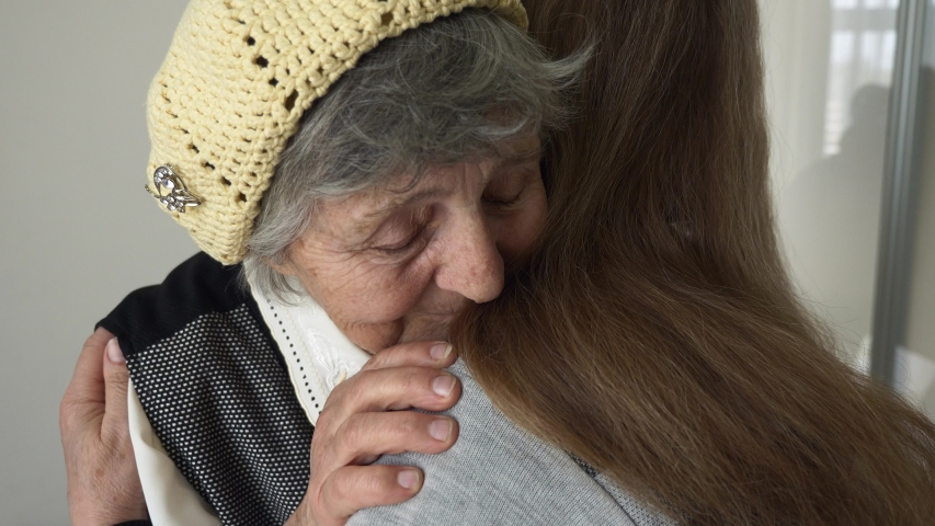 Elderly Woman Glad to See her Mature Daughter. Touching Stroking and Hugging. Family Reuniting Gladness and Happiness Emotions. 2x Slow motion 0.5 speed 60 fps Royalty-Free Stock Footage #1050894148
