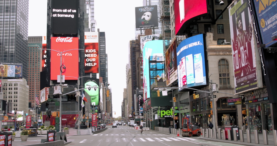 New York, NY / USA - April 19 2020: 
Empty Times Square, Midtown Manhattan due to coronavirus COVID-19 outbreak and social distancing regime 