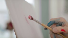 Close-up of adults hand painting pictures on canvas in art class. - Powered by Shutterstock - Get 15% off with code: PIKWIZARD15