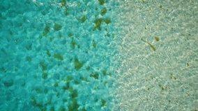 Drone clip flying over a clear blue Caribbean Sea in Los Roques, Venezuela