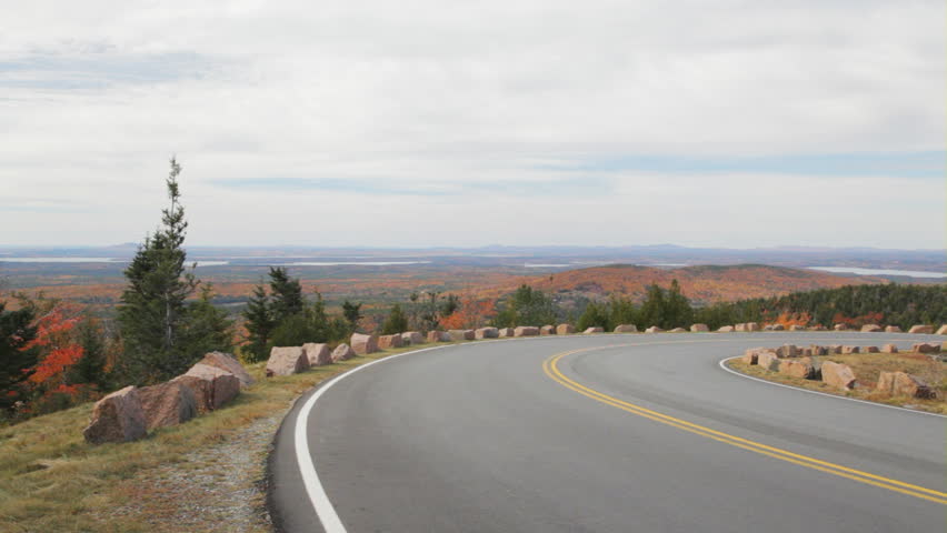 Pan of a portion of the Park Loop Road on Cadillac Mountain in Acadia National Park, Maine on an Autumn day.