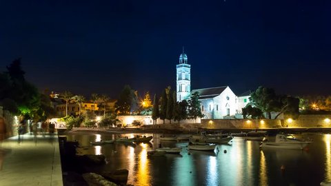HVAR - JUNE 02: Time Lapse scene in 4K of the famous Franciscan Monastery in Hvar town by night with view on the coastline June 02, 2015 in Hvar, Croatia. 