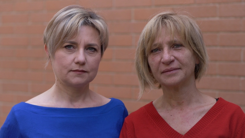 End of epidemic - two happy women smiling at camera