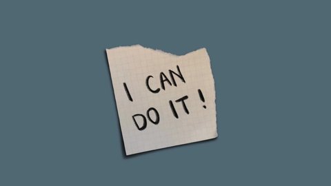 "You Can Do it!" hand written on torn grid paper, moving note on simple background, motivational concept. 