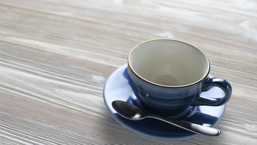 Pouring coffee into a cup
