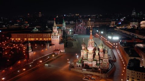 Moscow Kremlin, Saint Basil's Cathedral and Red Square at night in period COVID-19 without people, aerial view.