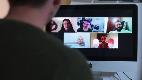 Communication of friends in video conference in social distance of the coronavirus infection COVID -19. Computer screen with group video conferencing. Social distance. CZ, Kladno, Selnera, 20.4.2020
