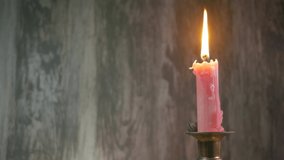 Candle in a candle stick background video with copy space