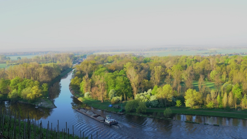 Cargo ship shipping gravel on the river. Shipping in the Czech Republic, Europe