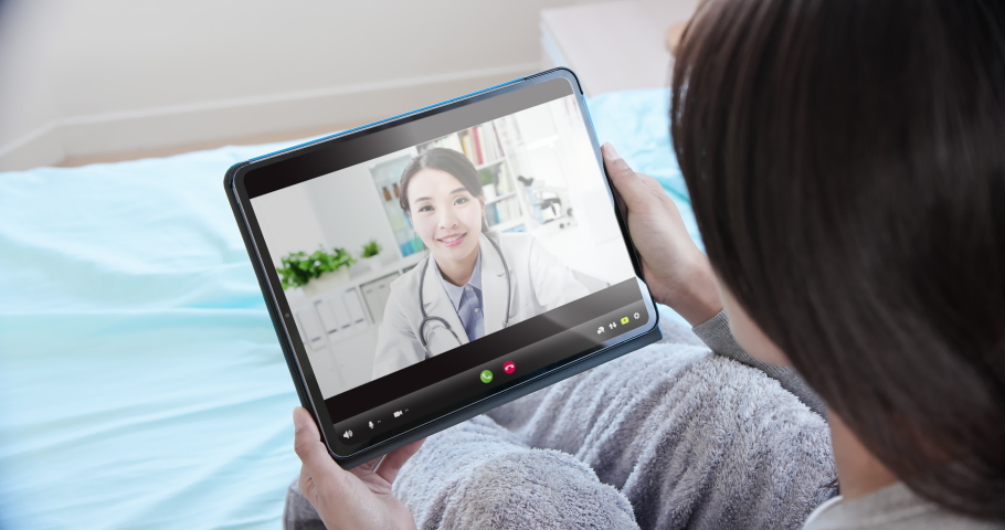 telemedicine concept - asian female patient use tablet pc to see the doctor Royalty-Free Stock Footage #1051022971
