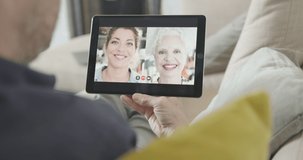 Mother and daughter connect trough video call on digital tablet at home during lockdown, wireless technology, connectivity, social care
