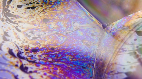 Colourful liquid water bubbles abstract background. Macro shot liquid flowing
