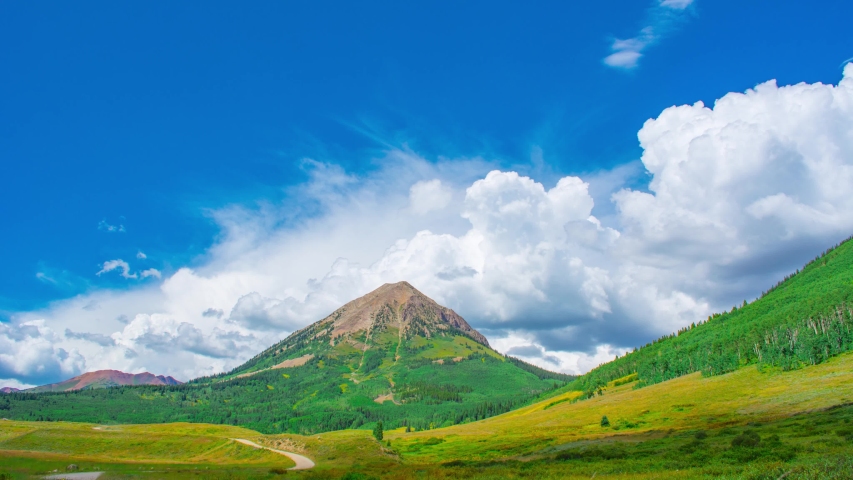 Lone Mountain With bolstering clouds Behind Jeep Road Time Lapse, Timelapse, Time-Lapse, 4K
