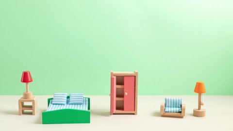 Stop motion animation with wooden toy furniture. Interior design, moving to new appartement, playng, zero waste educational toys concept