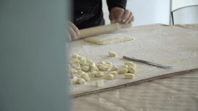 cutting pasta gnocchi pan front view