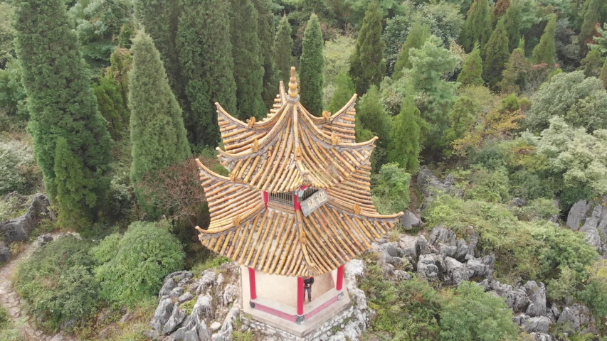 Aerial pan shot above a Chinese pavilion at Xishan Forest Park (Western Hills), near Kunming
