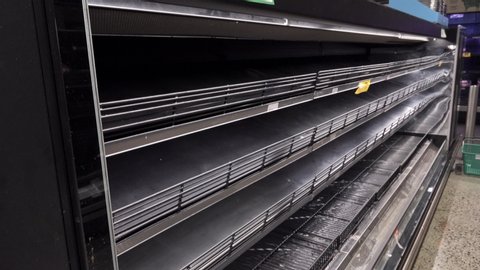 Empty shelves in a major supermarket. Panic has caused a shortage of some goods.