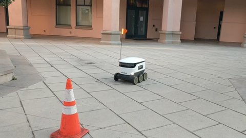 Mountain View, California / USA - April 22 2020: Starship Technologies delivery robot in downtown Mountain View, California transporting orders as people are staying at home due to COVID-19