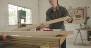 Worker young asian woman carpenter handle wood piece building design wooden working in workshop office studio, Personal business concept.