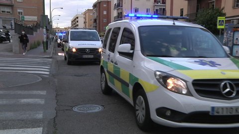 SEVILLA, SPAIN - April 14, 2020: A caravan of medical vehicles thanked the residents of Seville for their displays of affection during the pandemic that affected Spain due to Covid-19.