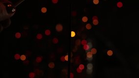festive sparkler and many sparks macro video bokeh background christmas and new year