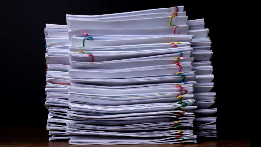 Stack overload document report paper with colorful paperclip place and copy space, bureaucracy business concept footage paperless used – 4K Stop motion. | Shutterstock HD Video #1051109923